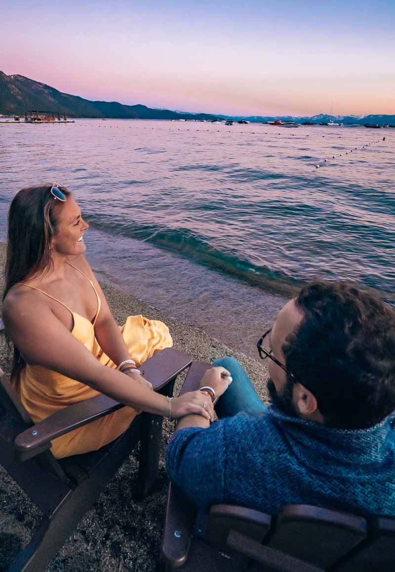 Couple watching lake tahoe sunset