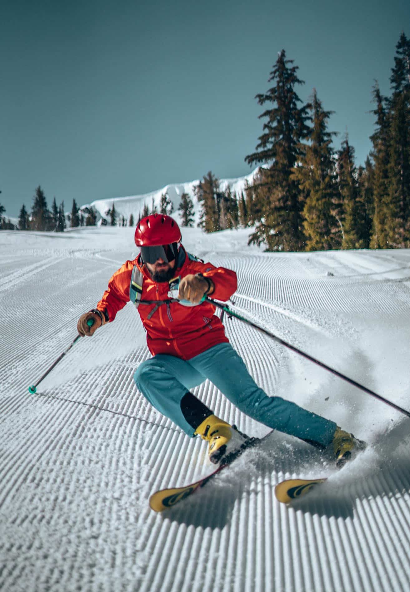 man skiing down mountain